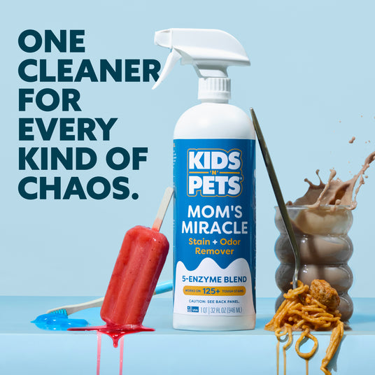 White spray bottle with blue label reading "Kids Pets Mom's Miracle Stain + Odor Remover" 32 fl oz, displayed with stain samp