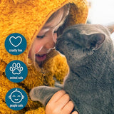 Child in yellow sweater hugging gray cat with cruelty-free, animal-safe, and people-safe certification badges displayed.